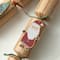 Glitzhome® 12" Christmas Kraft Paper Characters Tag Party Cracker with Gift Contents, 6ct.